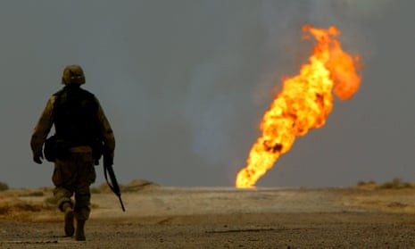 US ARMY SOLDIER WALKS TOWARDS BURNING OIL WELL IN SOUTHERN IRAQA U.S. Army soldier walks towards a burning oil well in Iraq’s vast southern Rumaila oilfields March 30, 2003. U.S. engineers moved through the oilfields on Sunday shutting down wellheads in an operation that could take months to complete. Having discovered a cache of arms and a minefield, U.S. troops must tread carefully in their mission to safeguard the region’s oilfields, which pumped more than half of Iraq oil exports before the war began. REUTERS/Yannis Behrakis