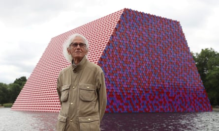 Christo stands in front of his work the London Mastaba on the Serpentine in Hyde Park, London, in 2018.