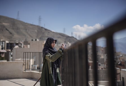 Asal, 35, on her rooftop.