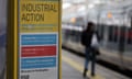 A public notice sign shows industrial action at Waterloo Station in London