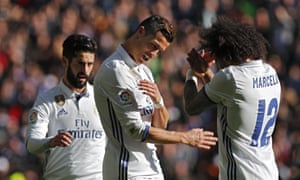 Cristiano Ronaldo celebrates with Isco and Marcelo after scoring the third.