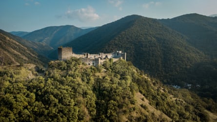 A stone castle on a hilltop without other mountains behind