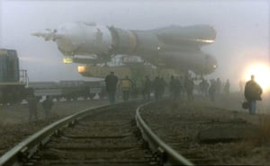 KAZAKHSTAN-SOYUZBKN03-20001029-BAIKONUR, KAZAKHSTAN: Members of the launch team supervise the transport of the “Soyuz” rocket to the launch pad at the cosmodrome Baikonur, Sunday 29 October 2000 for the upcoming historic manned mission to the International Space Station (ISS) on October 31. EPA PHOTO EPA/SERGEI CHIRIKOV