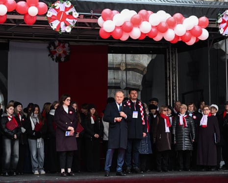Mayor of Gdansk Aleksandra Dulkiewicz (C-L), Polish prime minister Donald Tusk (C) and head of the Office for War Veterans and Victims of Repression Lech Parell (C-R) attend the Independence Day celebrations in Gdansk, northern Poland.