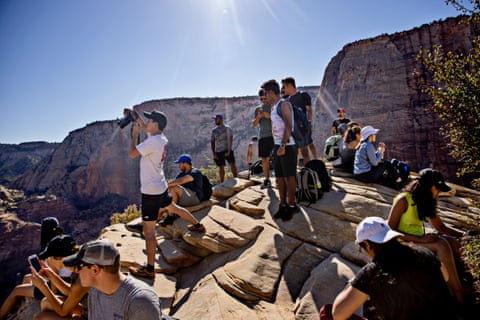 Hikers gather at the top of Angels Landing in Zion national park, Utah. 