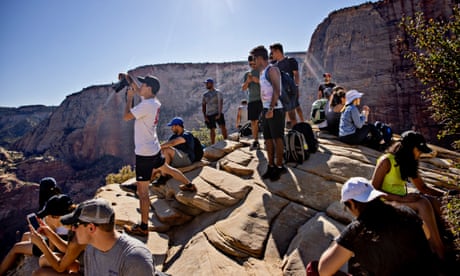 Hikers gather at the top of Angels Landing in Zion national park, Utah.