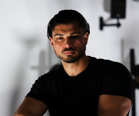 Danyluk in a black T-shirt stares into the camera