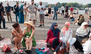 People in Antwerp hold a beach party this summer to protest at the burkini ban over the border in France.