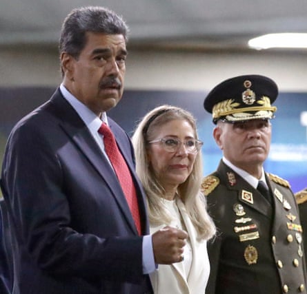 Nicolás Maduro, his wife, Celia Flores, and the minister of defence, Vladimir Padrino López.