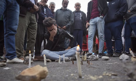 Demonstators hold a vigil in Khilani square yesterday after Friday night’s bloodshed.