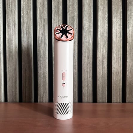Dyson HushJet Mini Cool on a wooden tabletop.