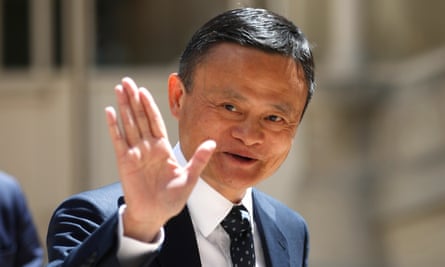 Jack Ma waves at reporters