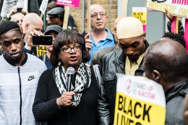 Diane Abbott, the shadow home secretary, speaks at the Justice for Rashan Charles vigil outside Stoke Newington police station in London on 29 July.