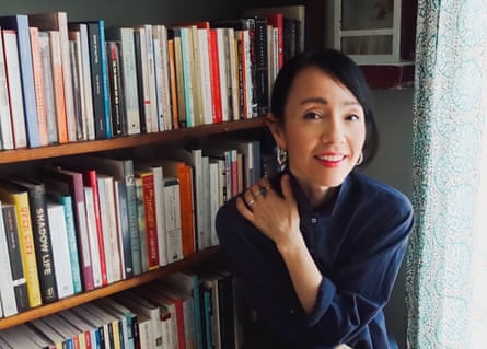 the author Kyo Maclear in front of a bookshelf