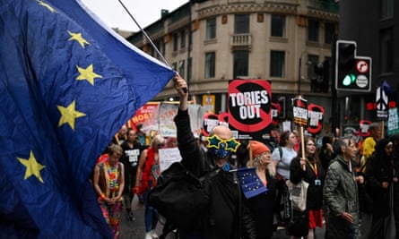 A demonstrator waves a giant EU flag in Manchester during the Conservative party Conference