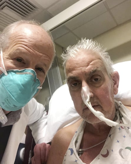 In this photo provided by the University of Maryland School of Medicine, Dr Bartley Griffith takes a selfie photo with patient David Bennett.