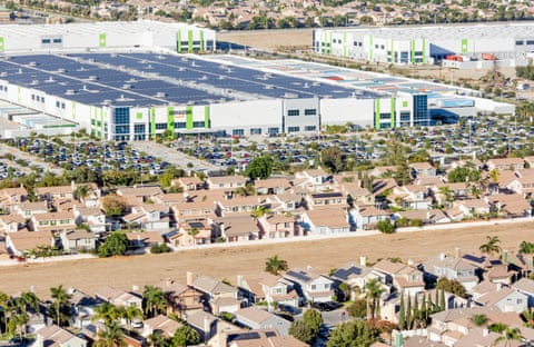 An Amazon facility behind a stretch of tract homes in Fontana, California.