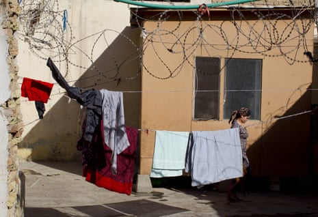 An inmate walks past in the courtyard at the Mazar-i-Sharif women’s prison, where many are detained for ‘moral crimes’.
