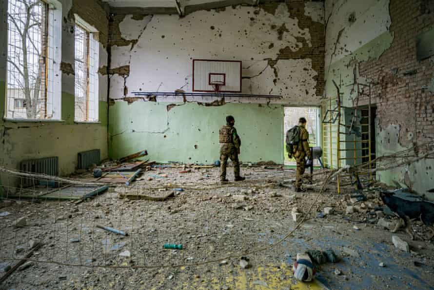 Ukrainian soldiers check the sport centre of a school in the village of Luch, a village close to the frontline in the Mykolaiv region, Ukraine.