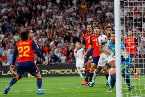 All eyes are on the ball as Harry Kane's header comes off the thigh of Spain's Marc Cucurella and heads into the net for England's second goal.