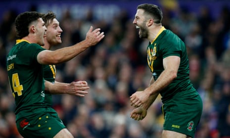 Australia's James Tedesco celebrates scoring his second try with teammates.