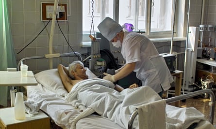 A tuberculosis patient having his blood pressure measured in eastern Siberia