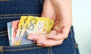 Hand taking banknotes out of pocket