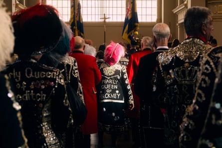 Group of pearlies stood near an altar in a church