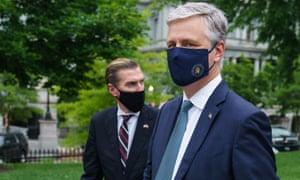 US National Security Advisor Robert O’Brien (R) is seen on the front driveway of the White House following an interview on 24 May 2020 in Washington, DC.