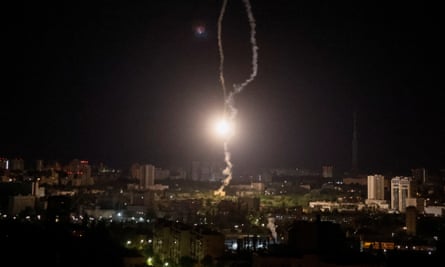 A missile exploding in the sky over Kyiv during a Russian missile strike