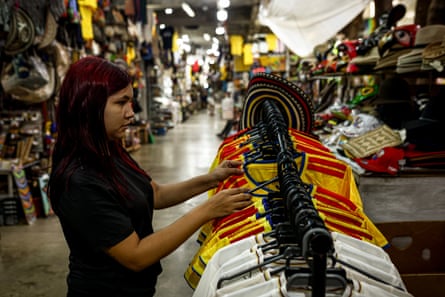 A woman looks at Columbian football shirts for sale