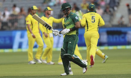 South Africa’s Reeza Hendricks walks off as Australian players celebrate claiming his wicket