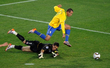 Luis Fabiano rounds Chile’s goalkeeper Claudio Bravo before slotting the ball home to score Brazil’s second goal.
