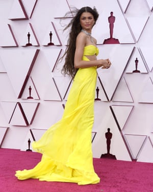 Bandeau dresses were the glammed up look of the night. Zendaya bedazzles in a lemon-yellow version which matched her PPE.