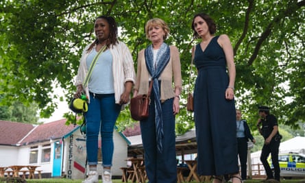 Jo Martin, Samantha Bond and Cara Horgan look down with horrified expressions in The Marlow Murder Club.