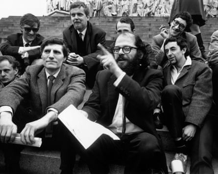Man with beard surrounded by other men