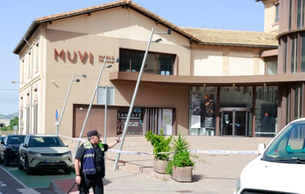 A policeman stood on the road outside the Museum of Villena, which is cordoned off with police tape