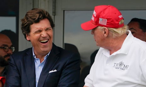 Tucker Carlson and Trump at the former president’s New Jersey golf club in July last year. A text this week showed Carlson said of Trump: ‘I hate him passionately.’