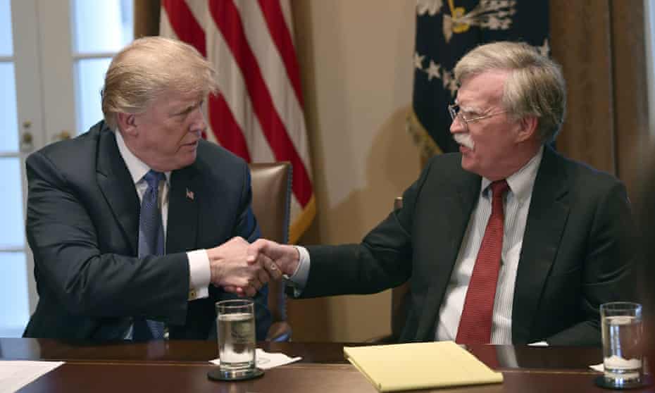 Donald Trump shakes hands with John Bolton