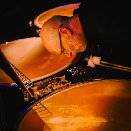 Man tuning drums