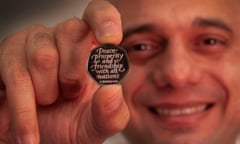 Brexit HM Treasury of Chancellor of the Exchequer Sajid Javid holding the Brexit coin, a 50p bearing the inscription 'Peace, prosperity and friendship with all nations' and the date the UK leaves the EU.