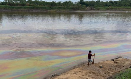 Rainbow oil slick on the River Cuninico, a major contributor to the Amazon River, in Loreto, Peru
