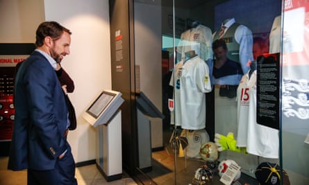 Gareth Southgate at the National Football Museum in 2019, looking at a display showing the waistcoat worn at the 2018 World Cup in Russia