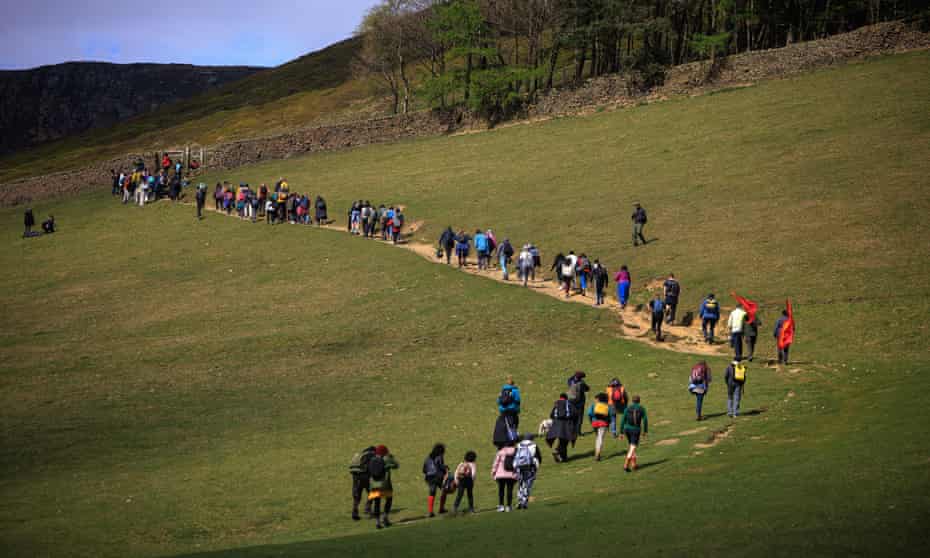 People walk from Edale to Kinder Scout to mark the 90th anniversary of a mass trespass at Kinder Scout