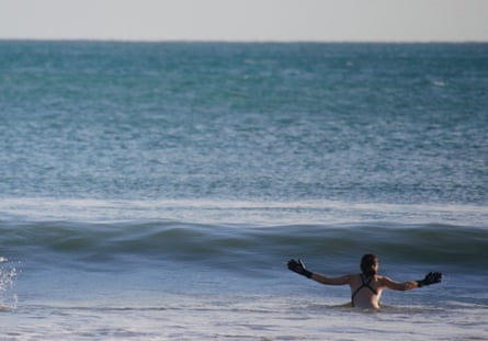 Woman with arms outstretched in the sea