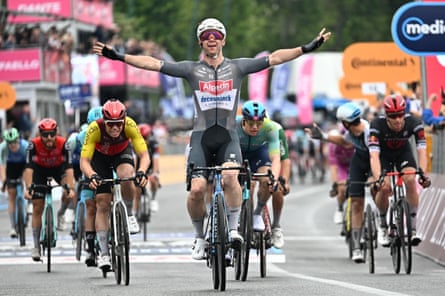 Kaden Groves celebrates winning the sixth stage