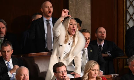 US Representative Marjorie Taylor Greene (R-GA) and Republican members of Congress react as US President Joe Biden delivers the State of the Union address in the House Chamber of the US Capitol in Washington, DC, on February 7, 2023.