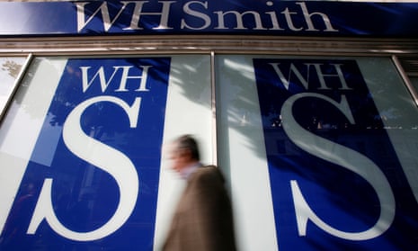 a man passes a WH Smith branch
