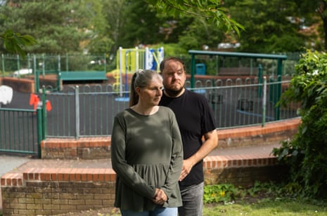 Sarah and Gary Andrews stood in a playground.