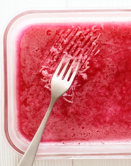 A glass tray of frozen strawberry flavoured alcohol.